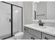 Bathroom features a glass shower with a gray vanity and black hardware and fixtures at 1095 Saltwater Cir, Johns Island, SC 29455