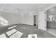 Open bedroom with neutral walls, gray carpet, and open entry to the bathroom at 1095 Saltwater Cir, Johns Island, SC 29455