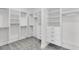 Spacious walk-in closet with built-in shelves and drawers at 1095 Saltwater Cir, Johns Island, SC 29455