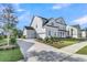 The property boasts a two-car garage and a well-maintained yard on a sunny day at 1095 Saltwater Cir, Johns Island, SC 29455