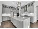 Gourmet kitchen with a large island, custom cabinets, and pendant lighting at 1095 Saltwater Cir, Johns Island, SC 29455