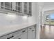 Detail shot of the kitchen with quartz countertops and gray shaker cabinets at 1095 Saltwater Cir, Johns Island, SC 29455