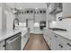 Modern kitchen featuring gray cabinets, quartz countertops, and stainless steel appliances at 1095 Saltwater Cir, Johns Island, SC 29455