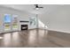 Spacious living room featuring a fireplace, hardwood flooring, and access to the backyard at 1095 Saltwater Cir, Johns Island, SC 29455