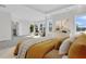 Bright and airy main bedroom with tray ceilings, bay window seating, and neutral decor at 1095 Saltwater Cir, Johns Island, SC 29455