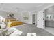Spacious main bedroom with tray ceilings, soft carpet, and ensuite bath access at 1095 Saltwater Cir, Johns Island, SC 29455