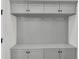 Mudroom includes gray cabinets, countertop, and wall hooks for storing coats and personal items at 1095 Saltwater Cir, Johns Island, SC 29455