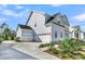 Side exterior shows the home has a two-car garage and plenty of yard space at 1095 Saltwater Cir, Johns Island, SC 29455