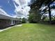 Lush, green backyard with a well-maintained lawn and brick home at 1102 Hampton Ct, Summerville, SC 29486