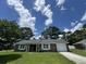 Charming brick home featuring a well-manicured lawn, attached garage, and inviting front entrance at 1102 Hampton Ct, Summerville, SC 29486