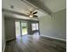 Spacious living room featuring sliding glass doors and modern wood flooring at 1102 Hampton Ct, Summerville, SC 29486