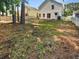Spacious backyard featuring white picket fence, patio area, and ample space for outdoor activities at 1128 Peninsula Cove Dr, Charleston, SC 29492