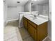 Bathroom featuring a tiled floor, wood vanity with a white countertop, and a large framed mirror at 1128 Peninsula Cove Dr, Charleston, SC 29492