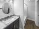 A pristine bathroom features a vanity with a granite countertop, vessel sink, and an enclosed shower at 1128 Peninsula Cove Dr, Charleston, SC 29492