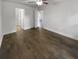 Bedroom featuring hardwood floors and a view into the bathroom and a hallway at 1128 Peninsula Cove Dr, Charleston, SC 29492