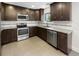 Well-equipped kitchen with stainless steel appliances, granite countertops, and backsplash at 1128 Peninsula Cove Dr, Charleston, SC 29492