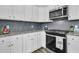 Modern kitchen with stainless steel appliances and granite countertops at 1144 Wading Point Blvd, Huger, SC 29450