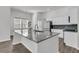 Large kitchen island with granite countertops and modern appliances at 1144 Wading Point Blvd, Huger, SC 29450