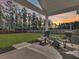 Relaxing patio with comfortable seating overlooking a large, manicured backyard at 1144 Wading Point Blvd, Huger, SC 29450