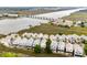 Expansive aerial view showcasing waterfront homes, bridge access, and scenic river views, perfect for coastal living at 116 W 2Nd St, Folly Beach, SC 29439