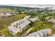 Panoramic aerial perspective of the waterfront homes, highlighting the community's lush landscaping and nearby ocean at 116 W 2Nd St, Folly Beach, SC 29439