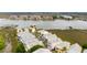 Breathtaking aerial view of the complex, nestled along the waterfront with a pier, offering serene views of the river at 116 W 2Nd St, Folly Beach, SC 29439