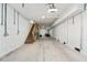 Spacious unfinished basement with concrete floors, exposed ceilings, and wooden stairs at 116 W 2Nd St, Folly Beach, SC 29439