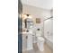 Well-lit bathroom with black fixtures, a white vanity, and a tub/shower combo at 116 W 2Nd St, Folly Beach, SC 29439