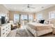 Spacious bedroom with stylish decor, featuring water views, a comfortable chair, and a plush rug at 116 W 2Nd St, Folly Beach, SC 29439