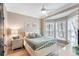This stylish bedroom features soft lighting, crown molding, and a cozy bed with decorative pillows at 116 W 2Nd St, Folly Beach, SC 29439