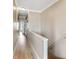 Bright hallway showcasing hardwood floors, neutral paint, and elegant trim, offering a welcoming transition at 116 W 2Nd St, Folly Beach, SC 29439