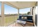 Enjoy outdoor living on this screened-in patio, featuring cozy seating and beautiful views at 116 W 2Nd St, Folly Beach, SC 29439