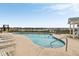 Inviting community pool with lounge chairs, offering a relaxing and scenic recreational space for residents near the waterway at 116 W 2Nd St, Folly Beach, SC 29439