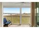 Relaxing screened porch offering scenic views of the water, with comfortable seating, and a calming atmosphere at 116 W 2Nd St, Folly Beach, SC 29439
