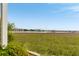 Enjoy serene waterfront views with a pier extending over marsh grasses to adjacent buildings from this amazing property at 116 W 2Nd St, Folly Beach, SC 29439
