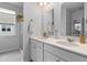 Bright bathroom features double sinks, gold fixtures, and a walk in shower at 1173 Wading Point Blvd, Huger, SC 29450
