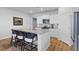 This kitchen features granite countertops, an eat-in island, stainless steel appliances and wood floors at 1173 Wading Point Blvd, Huger, SC 29450
