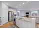 Bright and spacious kitchen features granite countertops, stainless steel appliances, and wood flooring at 1173 Wading Point Blvd, Huger, SC 29450