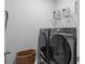 This laundry room features a gray Samsung washer and dryer, wire rack and neutral paint at 1173 Wading Point Blvd, Huger, SC 29450