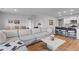 Open concept living space offers wood floors and comfortable seating with great natural light at 1173 Wading Point Blvd, Huger, SC 29450