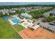 Aerial view of community amenities, including a pool, playground, and clubhouse in a residential area at 122 Foxglove Ave, Summerville, SC 29483