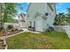 This backyard has a patio area and landscaping with a white picket fence at 122 Foxglove Ave, Summerville, SC 29483
