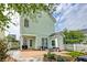 Backyard featuring a cement patio with outdoor seating, green siding, and white fence at 122 Foxglove Ave, Summerville, SC 29483