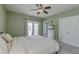 This is a bedroom with carpet flooring, a ceiling fan, and access to a balcony at 122 Foxglove Ave, Summerville, SC 29483