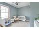 This is a bedroom with a crib, rocking chair, and carpet flooring at 122 Foxglove Ave, Summerville, SC 29483