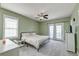 Spacious bedroom with carpet flooring, a ceiling fan, and access to a private balcony at 122 Foxglove Ave, Summerville, SC 29483