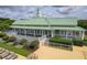 Exterior of the clubhouse with a green metal roof and white railings overlooking the pool area at 122 Foxglove Ave, Summerville, SC 29483