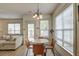 Cozy dining area with a round table, four chairs, and a view of the living room at 122 Foxglove Ave, Summerville, SC 29483