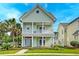 This exterior view of the home showcases the inviting front porch and curb appeal at 122 Foxglove Ave, Summerville, SC 29483