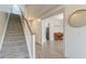 Spacious hallway with wood-look floors, leading to a staircase and an open living area at 122 Foxglove Ave, Summerville, SC 29483